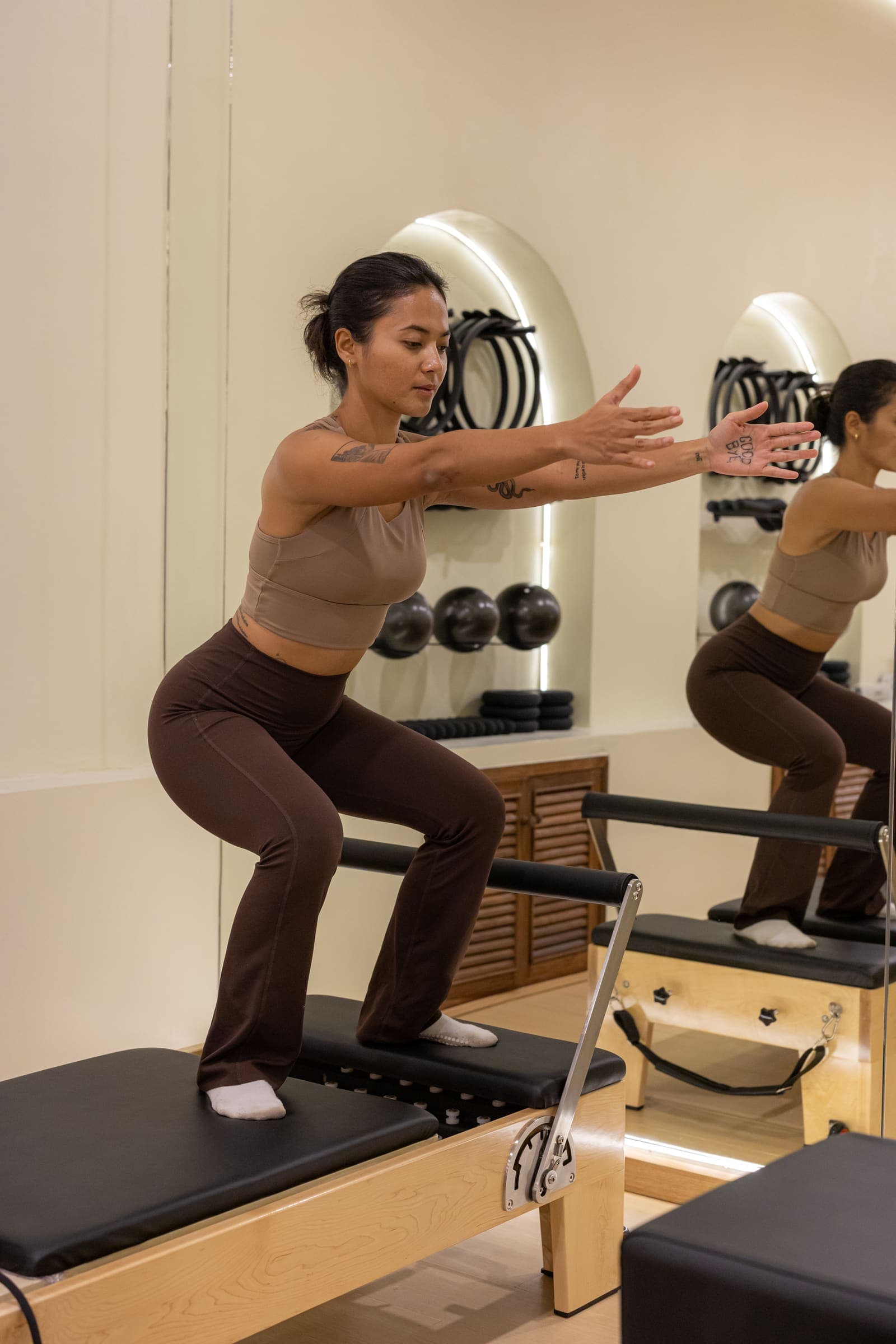 A client working on the reformer at Isla Pilates Samui