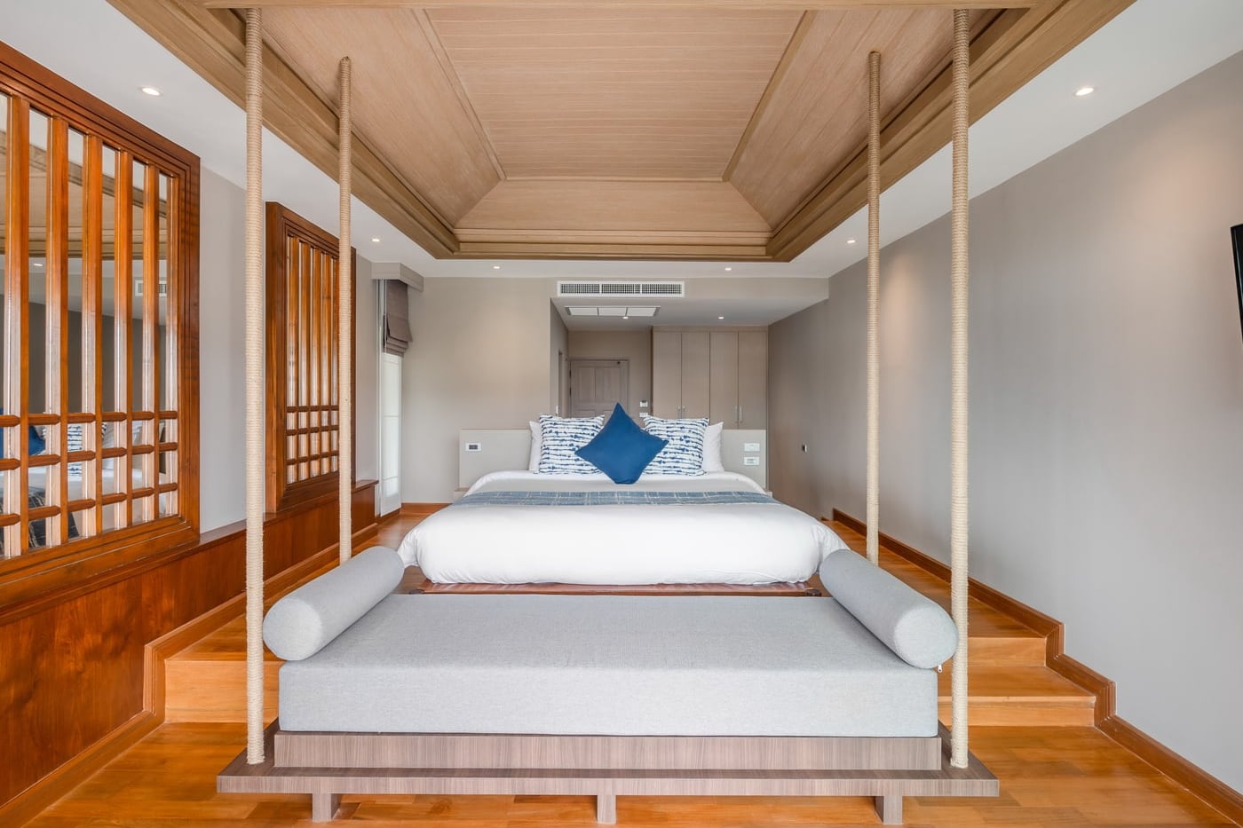 A suite at a beach resort on Koh Samui used for the Isla pilates retreat, a daybed at the foot of the bed